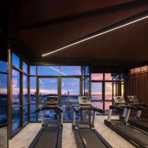 a gym with a view of the city at The Edge central pattaya in Pattaya