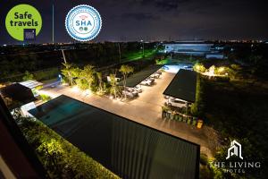 an overhead view of a swimming pool at night at The Living Hotel SamutPrakan in Bang Bo