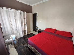Un pat sau paturi într-o cameră la Residence Jardin Tropical