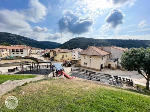 a park with a playground with a swing at Casa Zunbeltz de 3 habitaciones en plena montaña in Lezáun