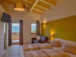 A bed or beds in a room at Naturhotel Edelweiss