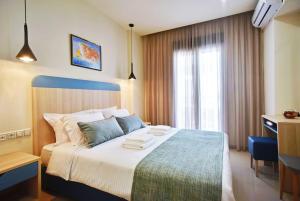 Postel nebo postele na pokoji v ubytování City Pearl Dntwn Apts