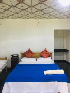 Кровать или кровати в номере Himansa Homestay