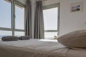 Postel nebo postele na pokoji v ubytování Panoramic sea view apartment