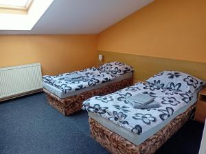 Postel nebo postele na pokoji v ubytování NEZNAŠOVY*** Restaurant-Penzion