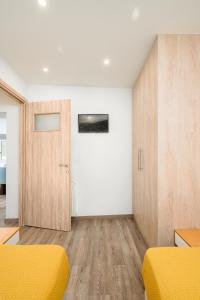 a room with two beds and a door at Niki Mountain House in Kamariótis