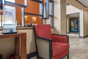 a red chair sitting at a bar in a restaurant at Comfort Inn Yulee - Fernandina Beach in Yulee