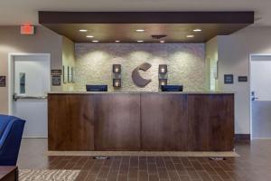 a lobby with a reception desk in a hospital at Comfort Inn & Suites Sidney I-80 in Sidney