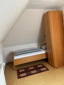 Postel nebo postele na pokoji v ubytování 4 **** Friesenhaus Werdum