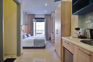 Postel nebo postele na pokoji v ubytování City Pearl Dntwn Apts