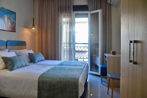Postel nebo postele na pokoji v ubytování City Pearl Dntwn Apts