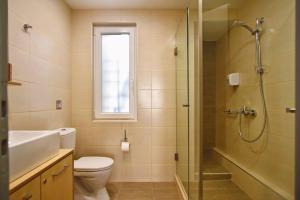 Koupelna v ubytování City Pearl Dntwn Apts + 28 fotografií