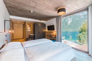 Posteľ alebo postele v izbe v ubytovaní Seehotel Einwaller - adults only