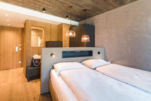 Posteľ alebo postele v izbe v ubytovaní Seehotel Einwaller - adults only