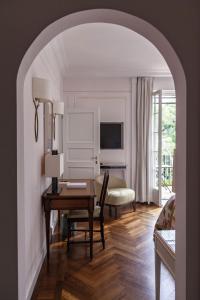 a living room with a desk and a bedroom at Splendido, A Belmond Hotel, Portofino in Portofino