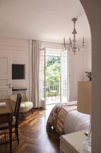 
a living room filled with furniture and a tv at Splendido, A Belmond Hotel, Portofino in Portofino
