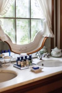 a bathroom counter with a sink and a window at Splendido, A Belmond Hotel, Portofino in Portofino