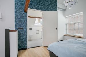 Llit o llits en una habitació de Hello Zeeland - Appartement Weststraat 36