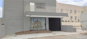 a building with a door with a stained glass window at Hotel Turismo in Trindade