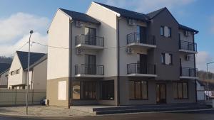 a large building with balconies on the side of it at Apartament 7 Budiu in Târgu-Mureş