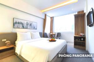 Postel nebo postele na pokoji v ubytování Keypad Hotel - 28 Dịch Vọng Hậu