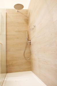 a bathroom with a shower with a shower head at Bellavista Apartment in Cagliari