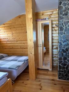 A bed or beds in a room at Zrubová Chata Sylvester
