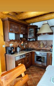 A kitchen or kitchenette at Zrubová Chata Sylvester