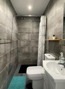 a bathroom with a toilet and a sink at Sea View Riviera- 4 bed apartment in Riviera del Sol with beautiful sea view! in La Cala de Mijas