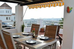 a table and chairs on a balcony with a view at Sea View Riviera- 4 bed apartment in Riviera del Sol with beautiful sea view! in La Cala de Mijas