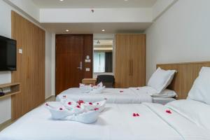 Postel nebo postele na pokoji v ubytování The Trios Hotel + 34 fotografií
