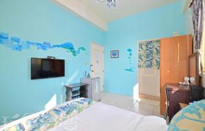 TV a/nebo společenská místnost v ubytování 沿海地帶 海景民宿 coastland B&B
