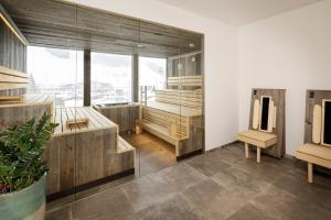 A bed or beds in a room at Hotel VIEW - incl Joker Card in Summer