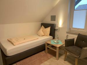 Postel nebo postele na pokoji v ubytování Hotel Schmidt's Hoern