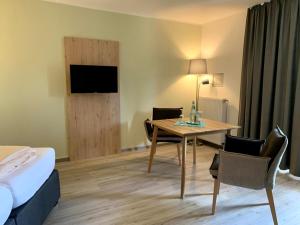 TV a/nebo společenská místnost v ubytování Hotel Schmidt's Hoern