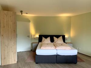 Postel nebo postele na pokoji v ubytování Hotel Schmidt's Hoern