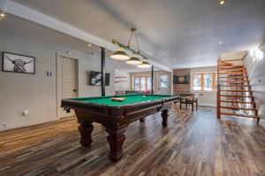 a room with a pool table and a staircase at Chalet familial, très bien situé in Mont-Blanc