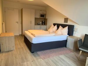 Postel nebo postele na pokoji v ubytování Hotel Schmidt's Hoern