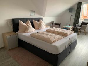 Postel nebo postele na pokoji v ubytování Hotel Schmidt's Hoern