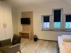 TV a/nebo společenská místnost v ubytování Hotel Schmidt's Hoern