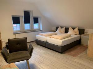 Postel nebo postele na pokoji v ubytování Hotel Schmidt's Hoern