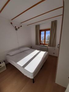 Posteľ alebo postele v izbe v ubytovaní Tonale 80