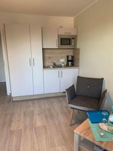Kuchyň nebo kuchyňský kout v ubytování Hotel Schmidt's Hoern