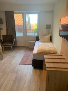 Postel nebo postele na pokoji v ubytování Hotel Schmidt's Hoern