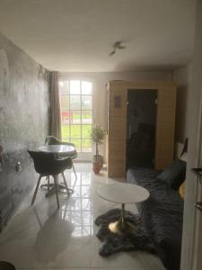 Posezení v ubytování B&B Bij Bijnen + 16 fotografií