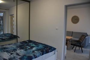 A bed or beds in a room at Apartament AMD Jastrzębia Góra 200 metrów od Morza
