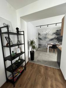 a living room with a black book shelf at Dablin 9 in Korbielów