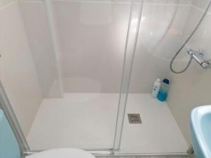 a bathroom with a shower with a toilet and a sink at Casa IRIENSE VUT-CO-004308 in Padrón +42 photos
