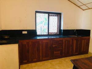 Televízia a/alebo spoločenská miestnosť v ubytovaní Malabar home stay