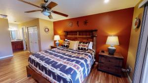a bedroom with a bed and a ceiling fan at Adventure Base Camp #381 in Moab +17 photos